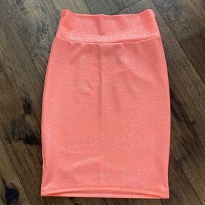 Orange Lularoe pencil skirt with shiny silver detail, size SM. NWOT